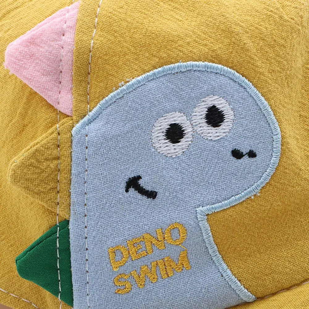 casquette bébé en coton imprimé dinosaure